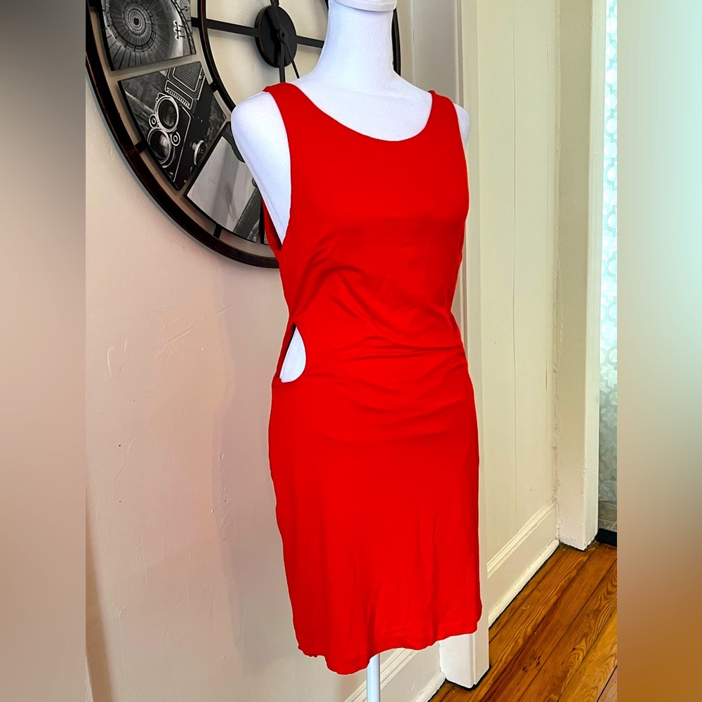 Red Bebe Dress with cutout sides. Size medium. Excellent condition. Fffiery red.
